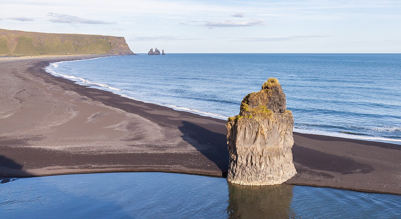 Reynisfjara's basalt coast and Reynisdrangar in 2014, Iceland; shoreline conditions have since changed